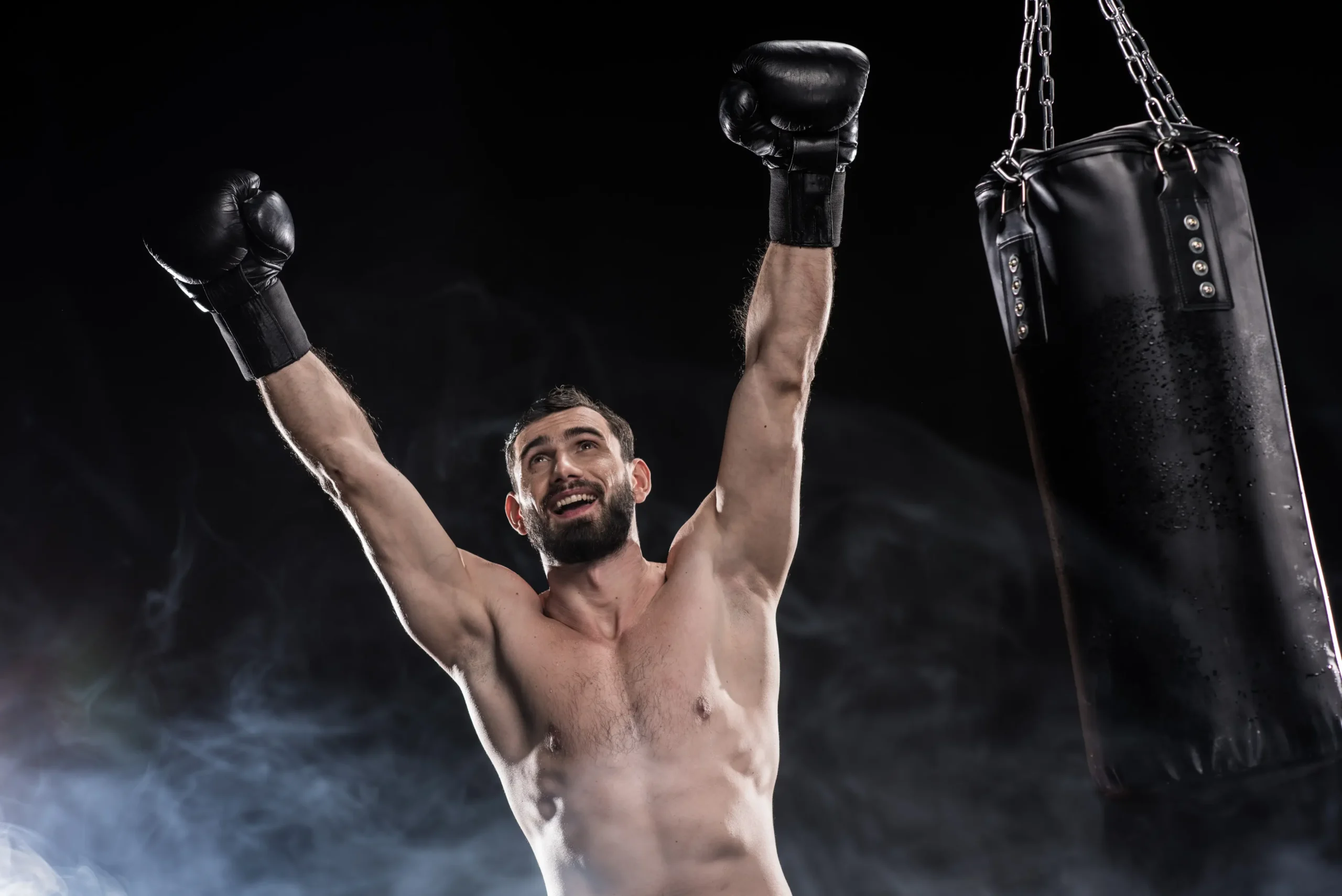 happy young boxer celebrating his victory raising 2024 11 14 06 00 10 utc scaled