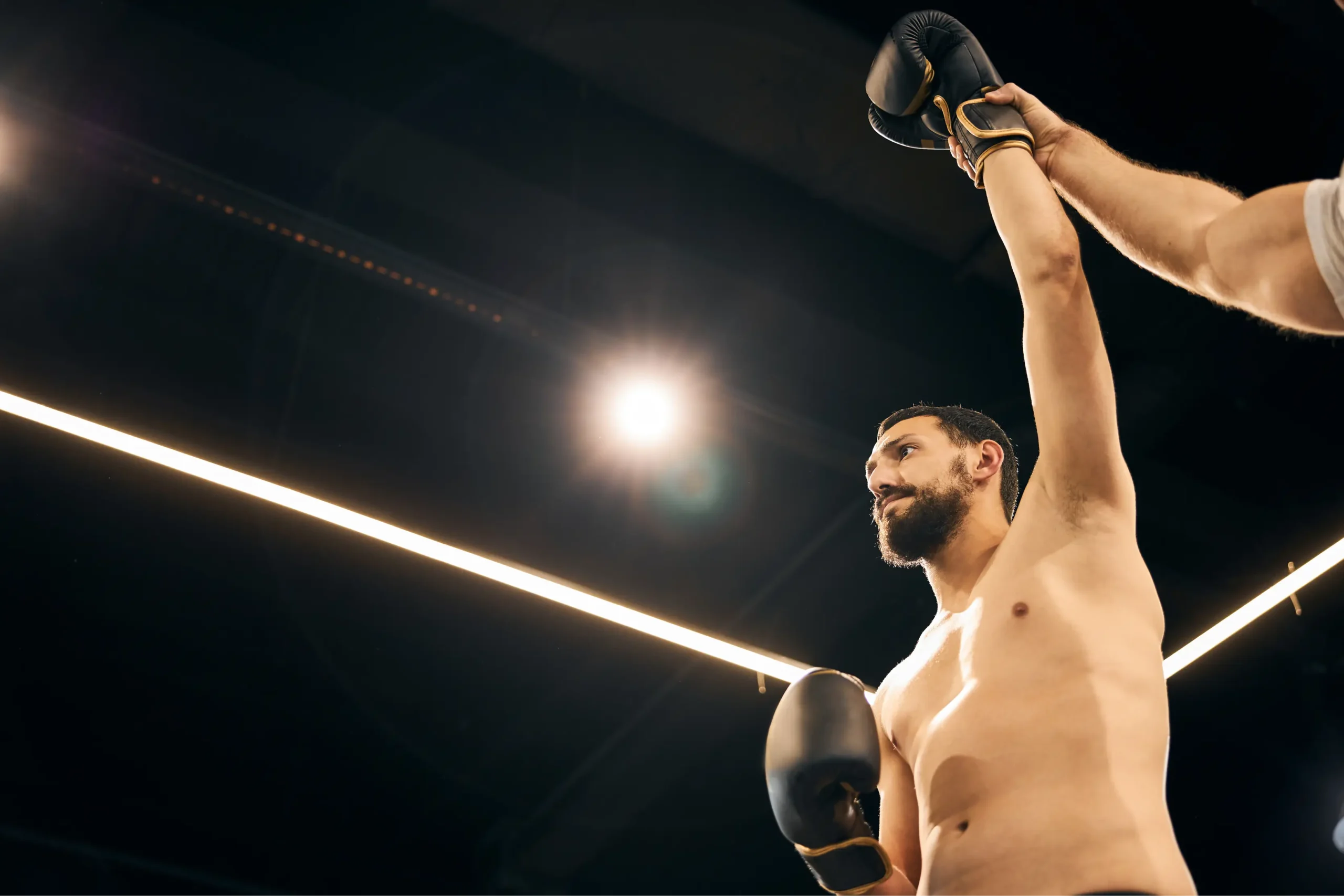 shirtless boxer standing with his hand in the air 2025 03 08 18 28 02 utc scaled